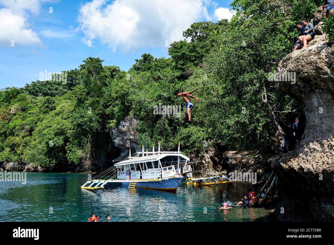 Jumping off a cliff to the sea Stock Photo Alamy