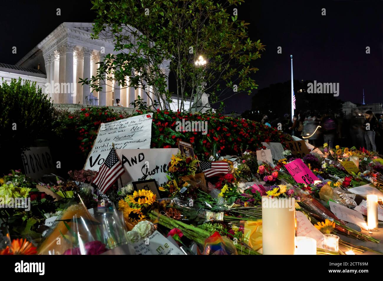 Flowers, candles, and signs left in front of the United States Supreme Court building in remembrance of Justice Ruth Bader Ginsburg, Washington, DC Stock Photo