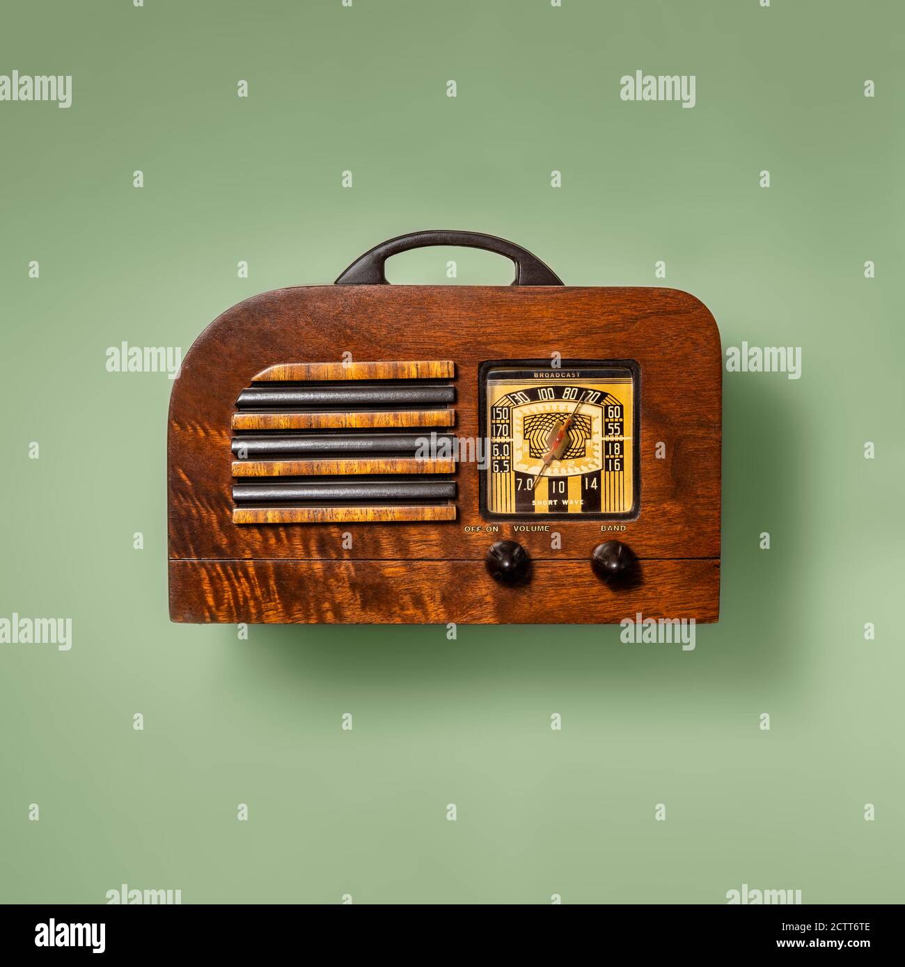 Retro wooden radio on green background Stock Photo