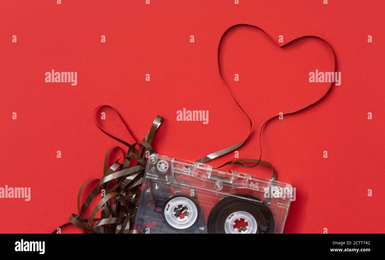 Analog audio cassette on red background Stock Photo