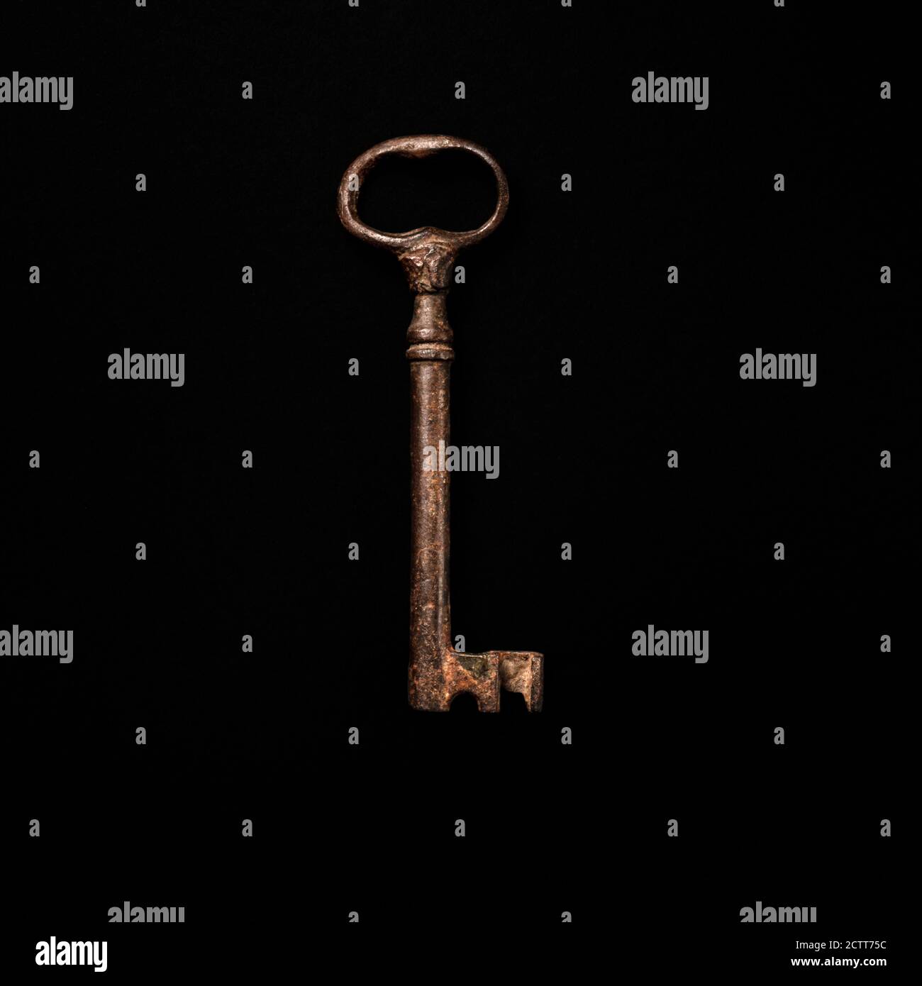 Antique key on black background Stock Photo