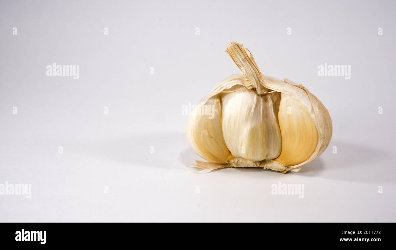 Garlic bulb clove in half cross section on white background Stock Photo