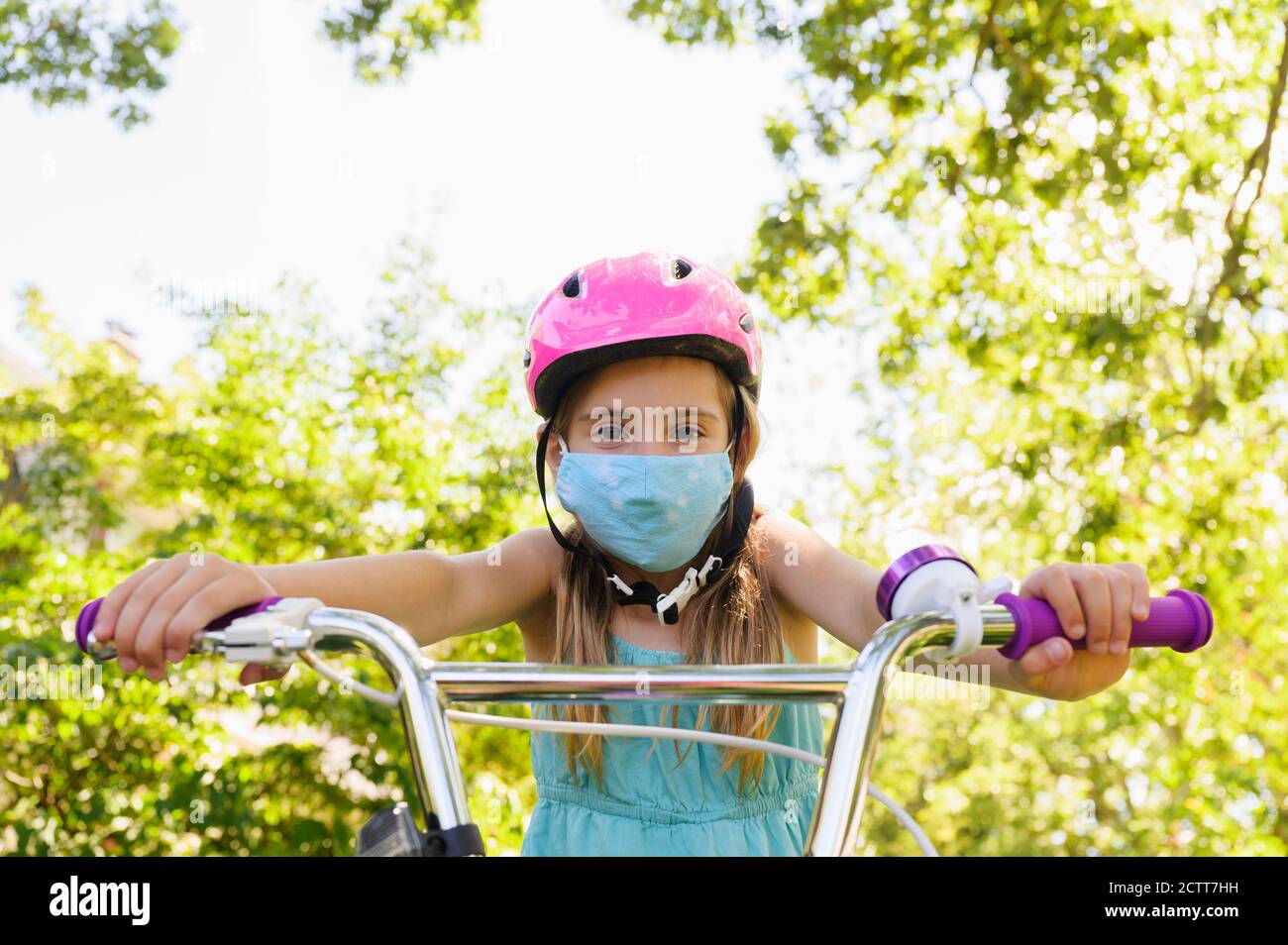 Girl wearing bicycle helmet hi-res stock photography and images - Alamy