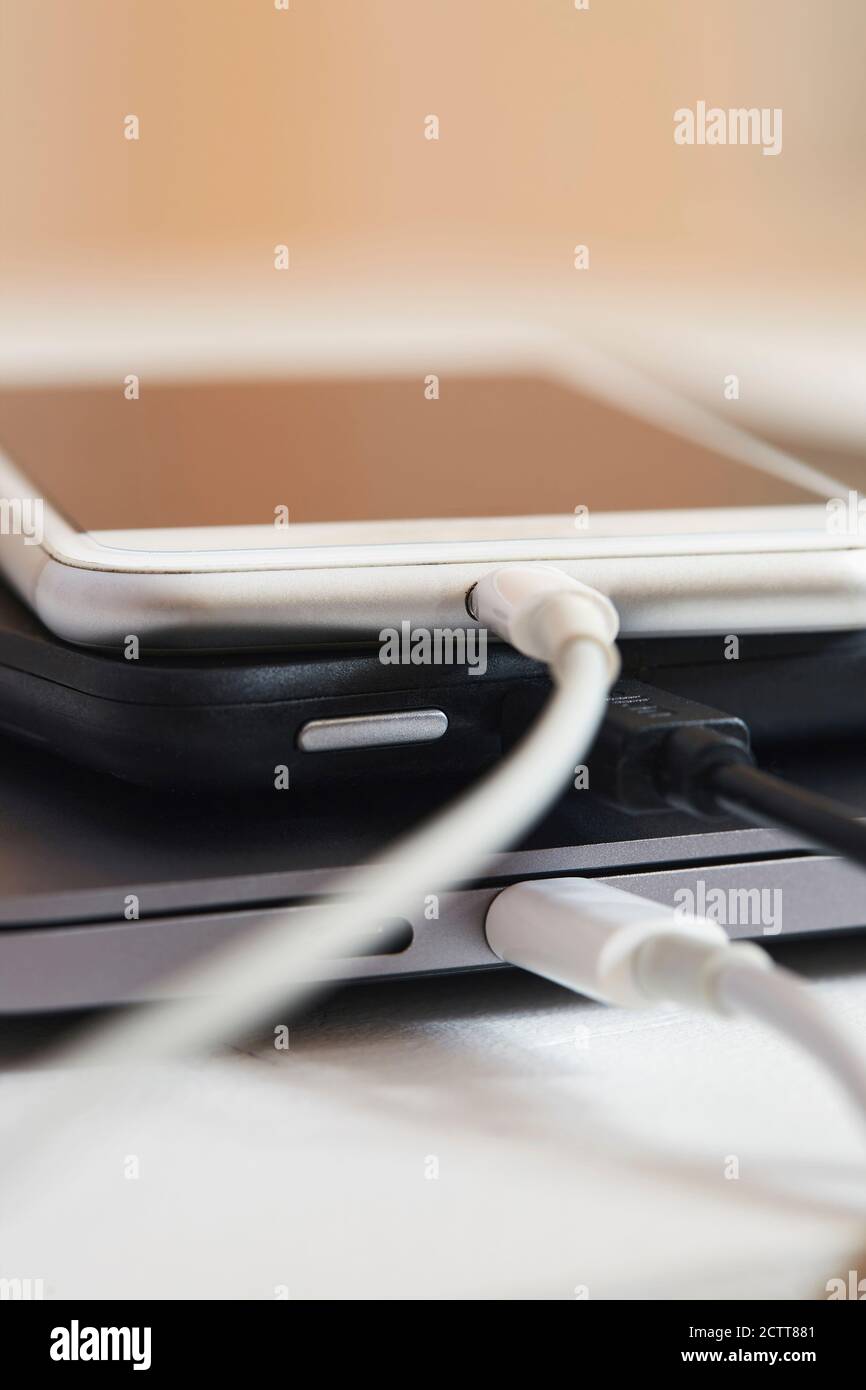 Close up of smartphone charging Stock Photo