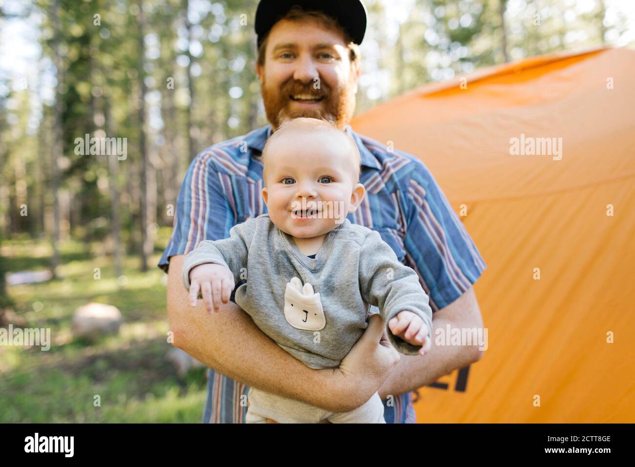 Portrait of happy father with baby son (6-11 months) in Uinta-Wasatch-Cache National Forest Stock Photo