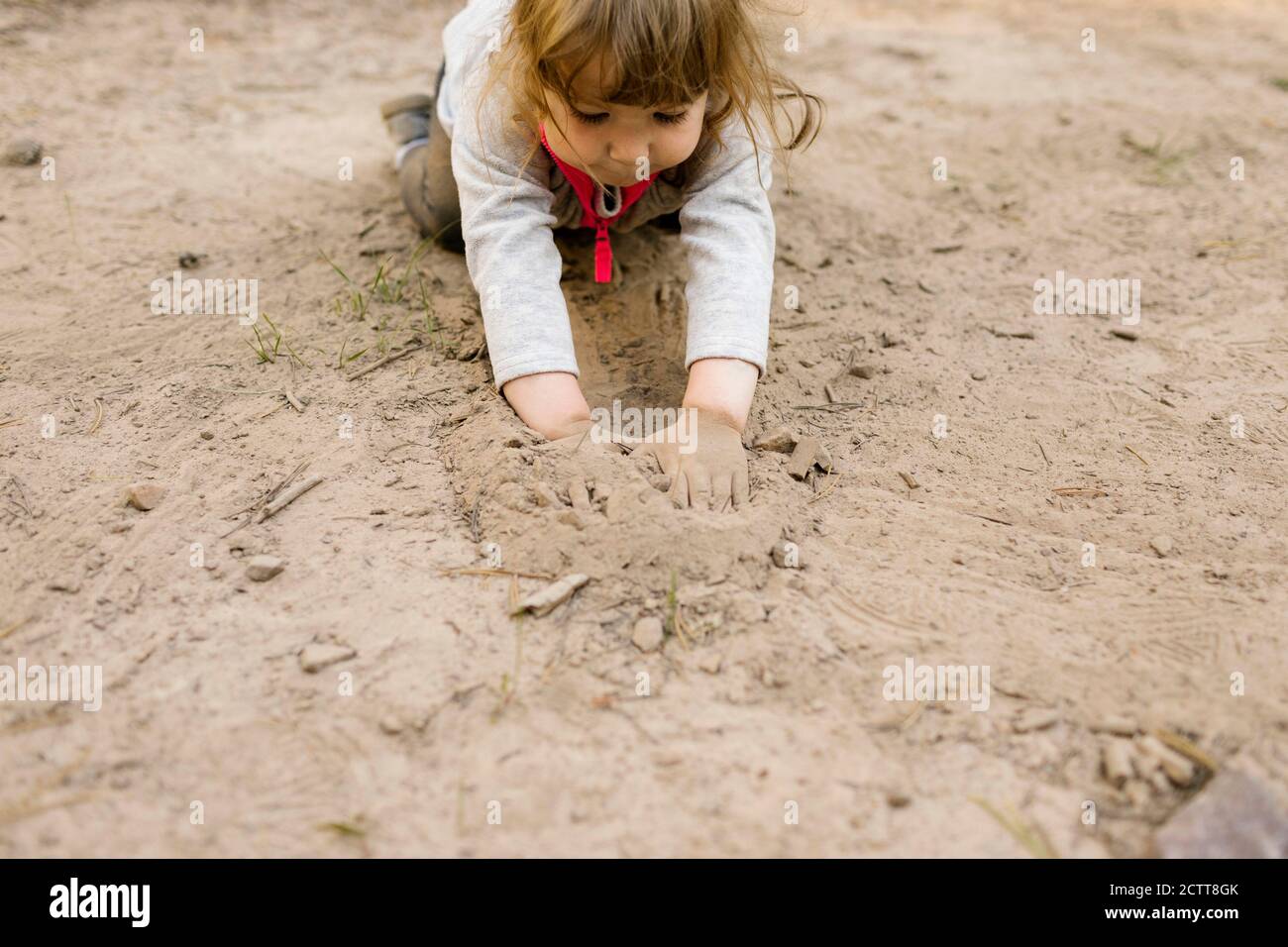 Girl (2-3) playing in sand, Wasatch Cache National Forest Stock Photo