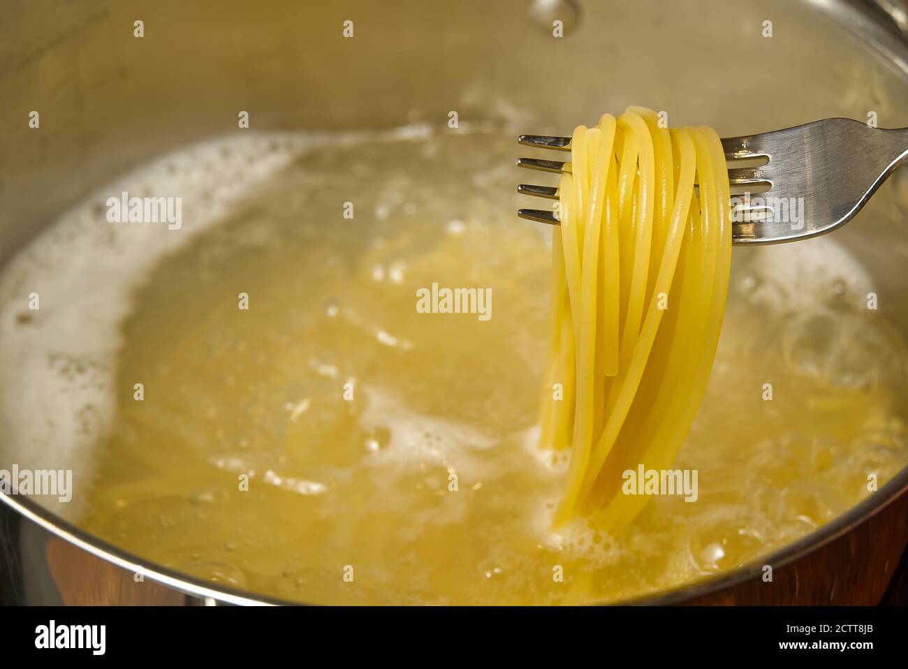 boiling pasta spaghetti in pot. penne rigate pasta Cooking pasta in