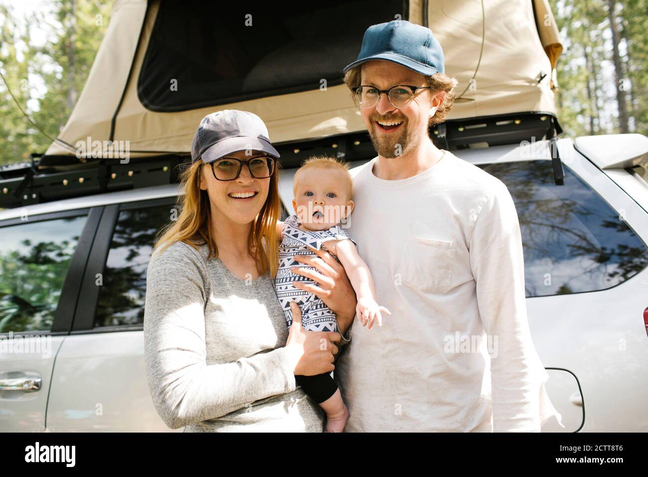Portrait of parents with baby son (6-11 months) on camping in forest, Wasatch Cache National Forest Stock Photo