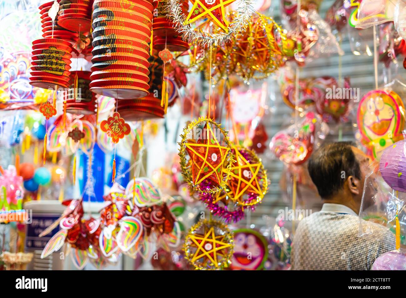 Decorated colorful lanterns hanging on a stand in the streets of Cholon ...