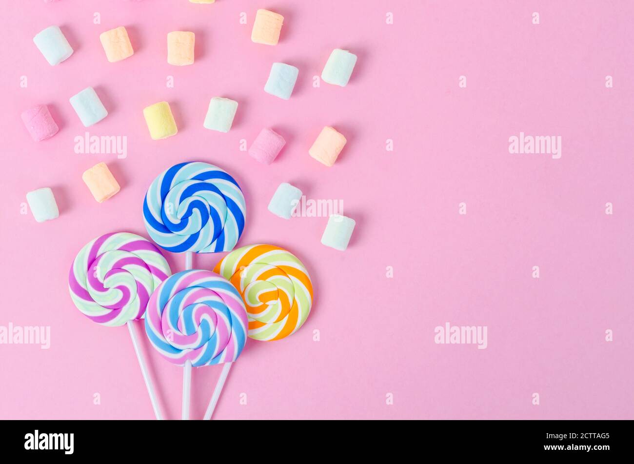 Colorful marshmallow with candy pastel pink background Stock Photo - Alamy