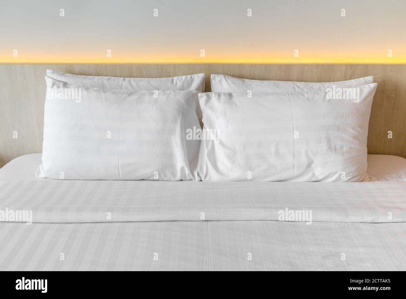 White pillows on a bed Comfortable soft pillows on the bed Stock Photo