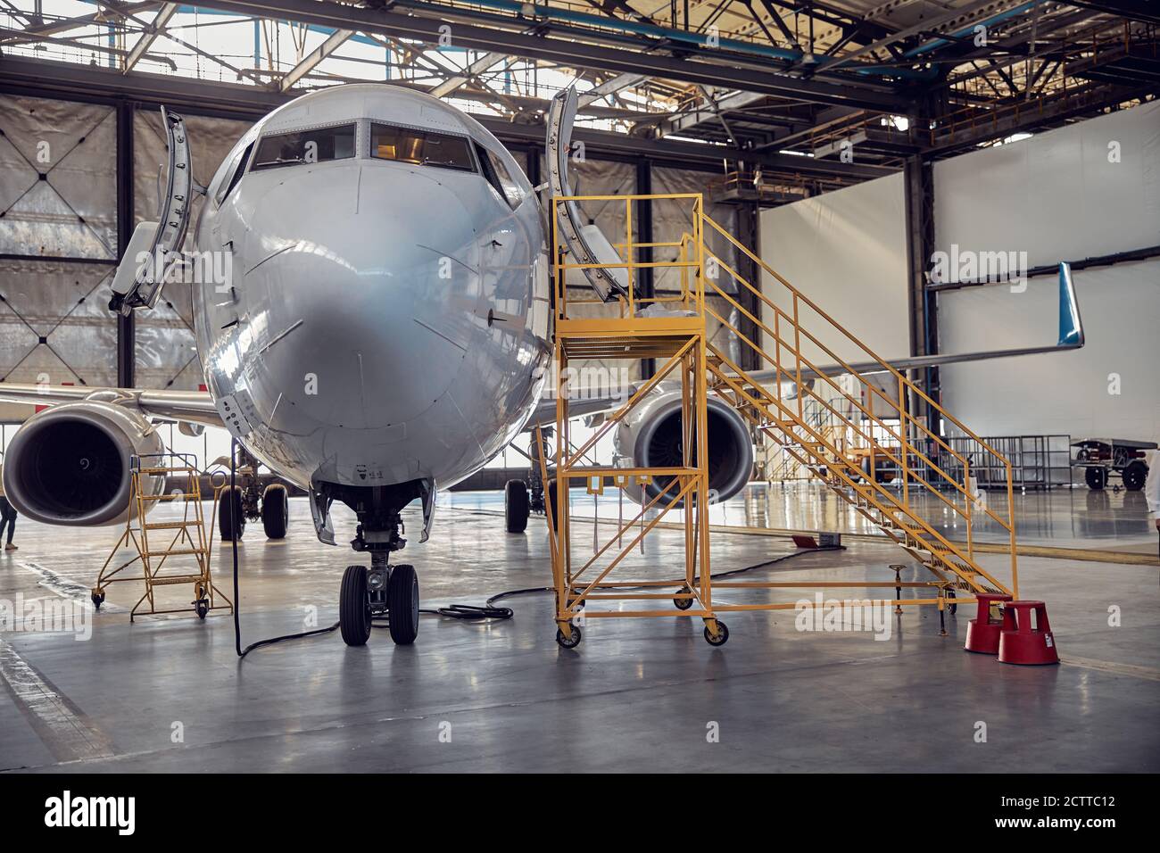 Airplane at parking apron in the aviation hangar Stock Photo Alamy