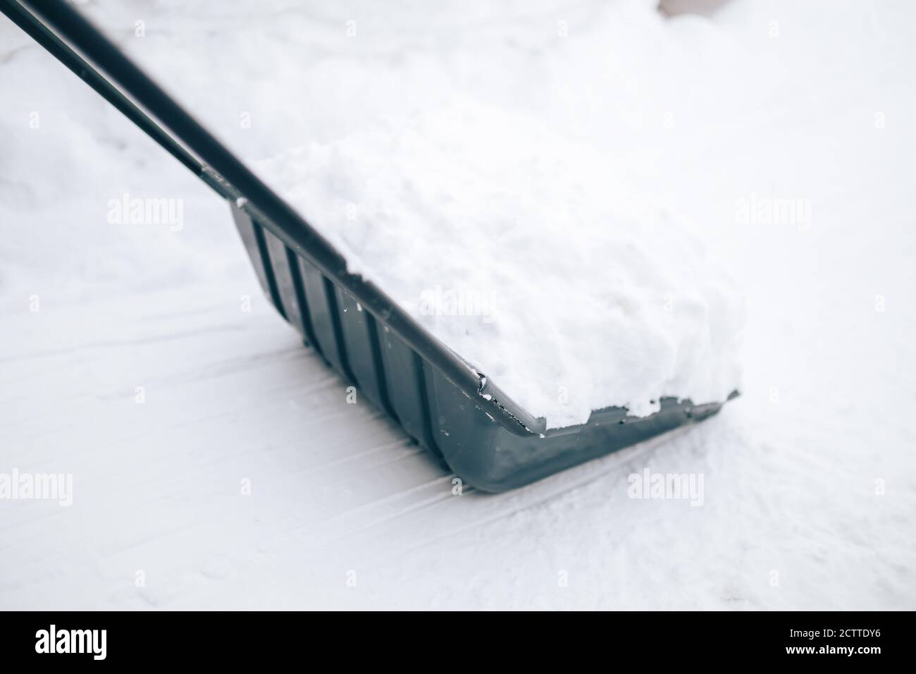 Snow removal with shovel Stock Photo Alamy