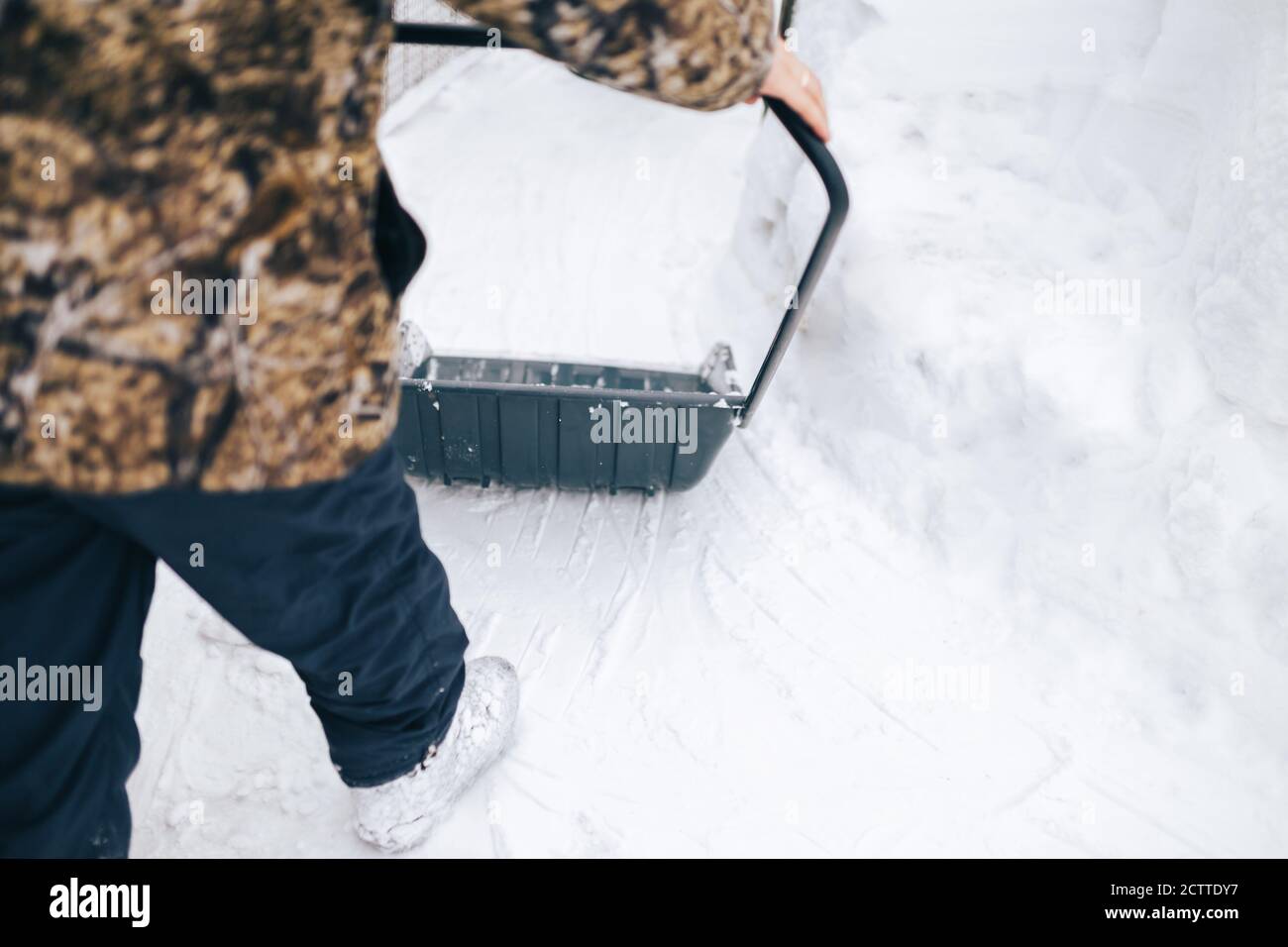 Snow removal with shovel Stock Photo Alamy