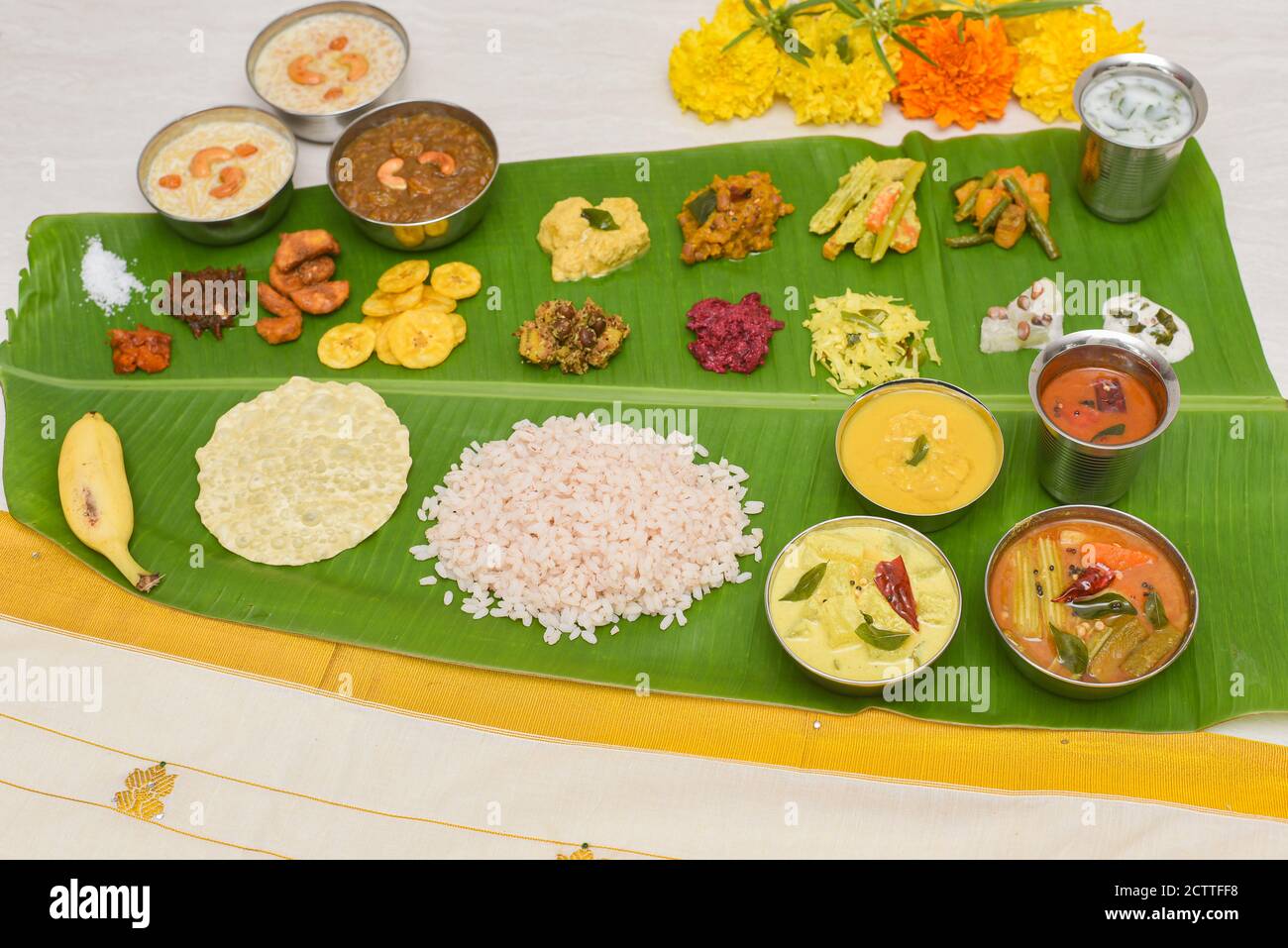 Onam sadhya, Indian women eating with hand boiled rice, served for Kerala Indian festival with curries Sambar, Avial, Thoran, Papadum, Payasam, Banana Stock Photo - Alamy Onam sadhya, Indian women eating with hand boiled rice, served for Kerala Indian festival with curries Sambar, Avial, Thoran, Papadum, Payasam, Banana Stock Photo - Alamy