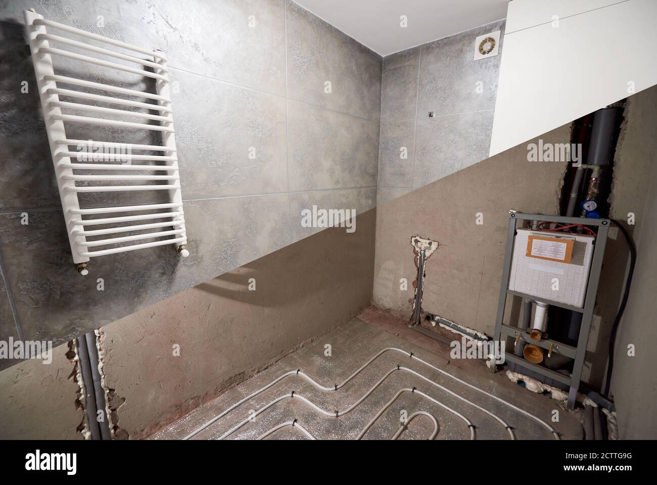 Comparison of bathroom in apartment before and after renovation. Interior design of a modern bathroom in grey tones, warm floor, water pipes and floor heating pipe system. Renovation concept Stock Photo