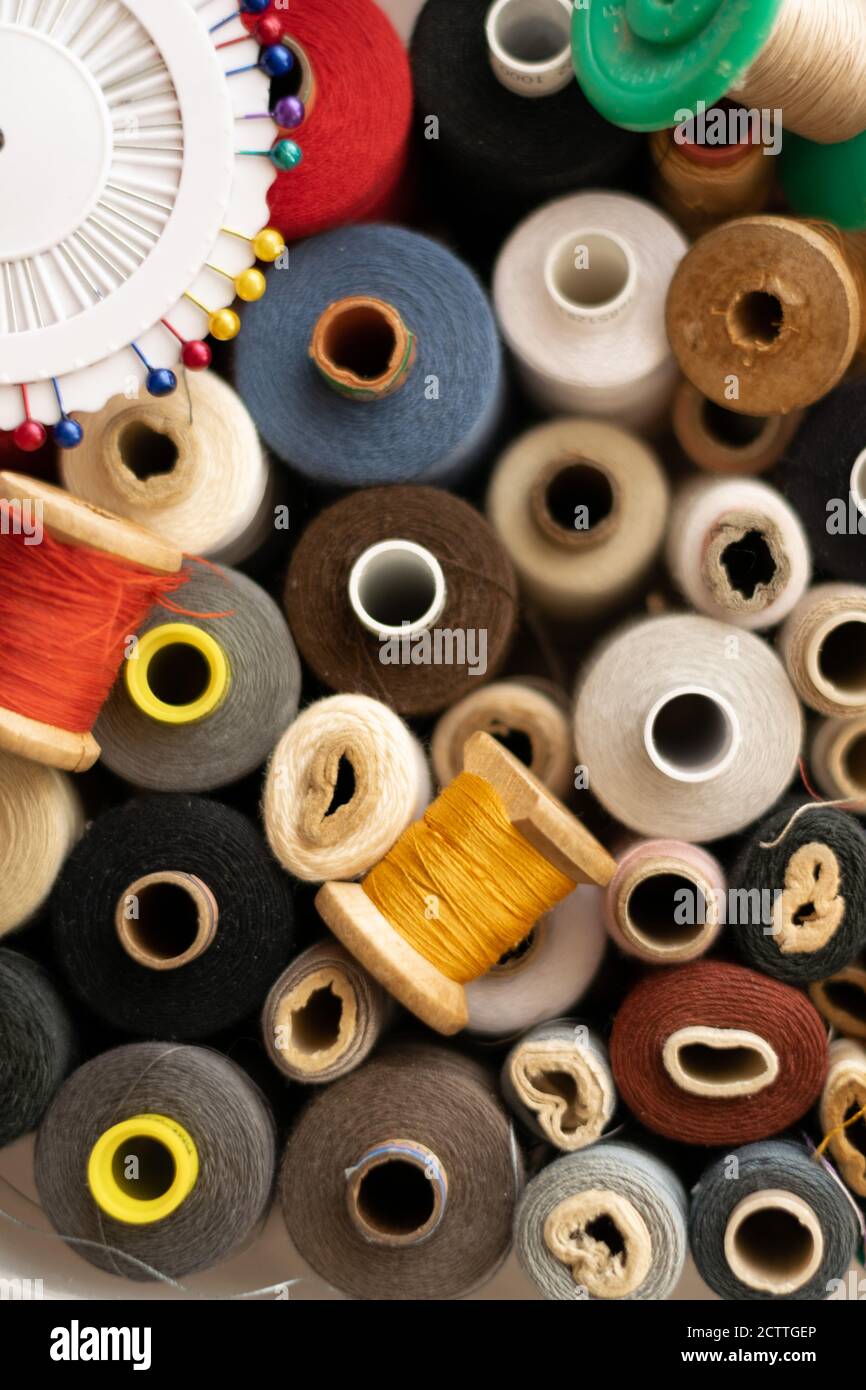 Crop view of different colorful cotton mill, sewing themes Stock Photo