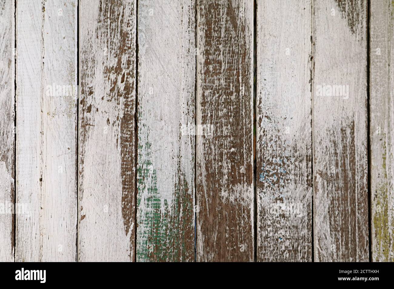 Old grunge colored vertical pattern wooden fence Stock Photo