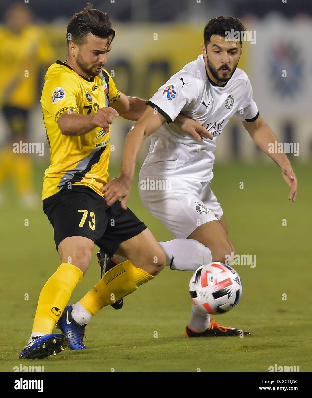 Doha, Qatar. 21st Sep, 2020. Rayan Yaslam (R) of Al Ain FC vies