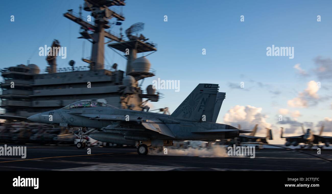 200912-N-ML137-2081 PHILIPPINE SEA (Sept. 12, 2020) An F/A-18F Super Hornet attached to the Diamondbacks of Strike Fighter Squadron (VFA) 102 lands on the flight deck of the Navy’s only forward-deployed aircraft carrier USS Ronald Reagan (CVN 76). Ronald Reagan, the flagship of Carrier Strike Group 5, provides a combat-ready force that protects and defends the United States, as well as the collective maritime interests of its allies and partners in the Indo-Pacific region. (U.S. Navy photo by Mass Communication Specialist 2nd Class Samantha Jetzer) Stock Photo