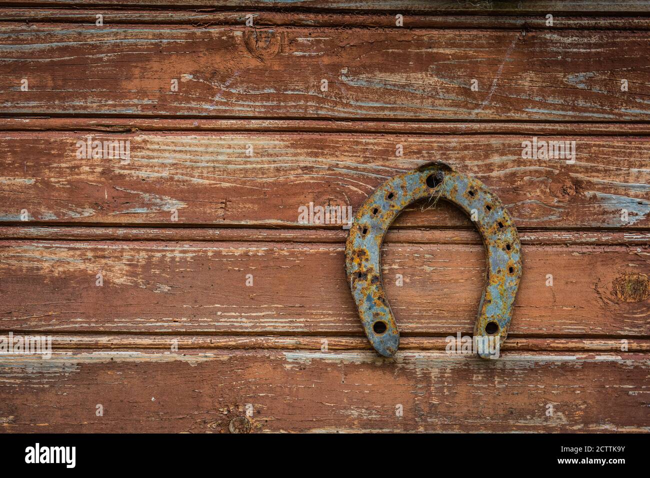 Horseshoe on a wooden old wall for good luck Stock Photo Alamy