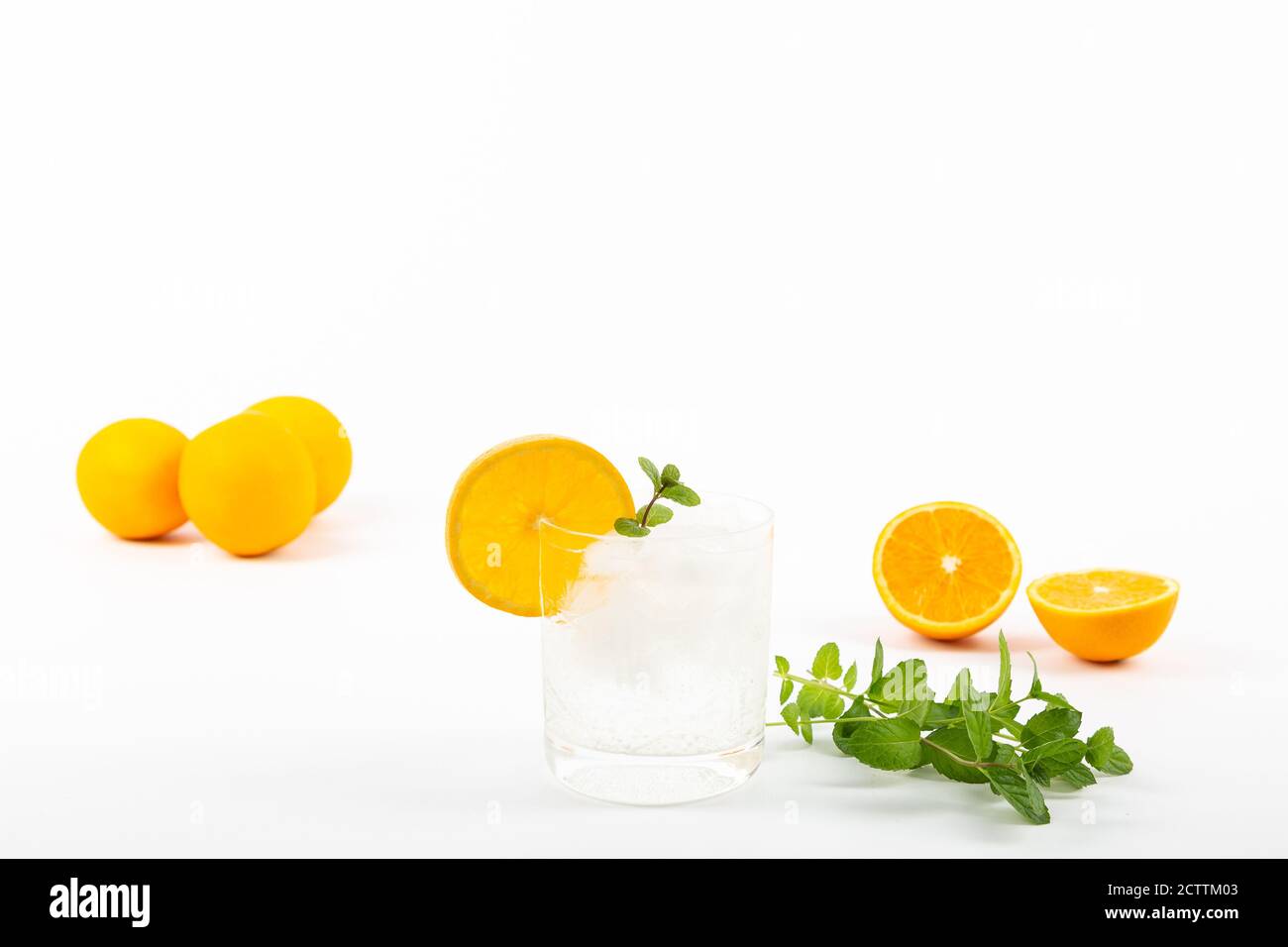 Glass of gin tonic with orange on white background Stock Photo Alamy