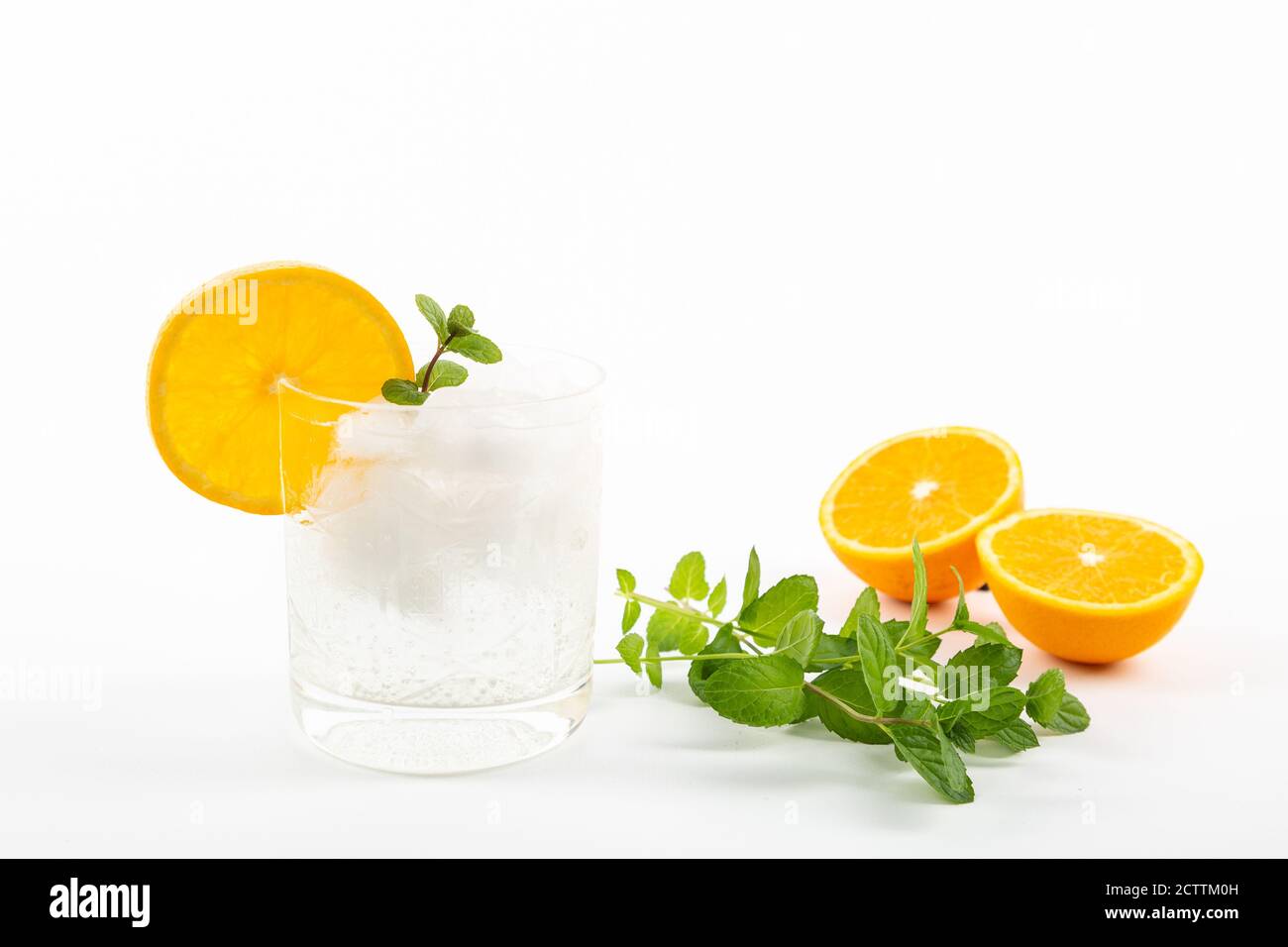 Glass of gin tonic with orange on white background Stock Photo Alamy
