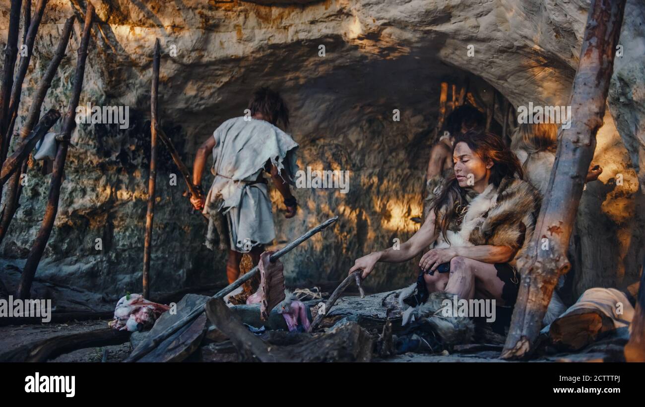 Tribe of HunterGatherers Wearing Animal Skin Live in a Cave. Leader