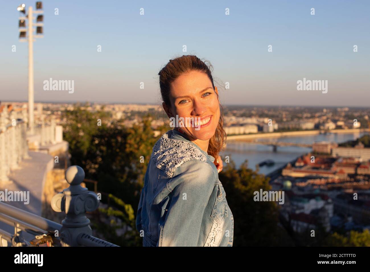 Happy young carefree Caucasian urban woman toothy smile Stock Photo