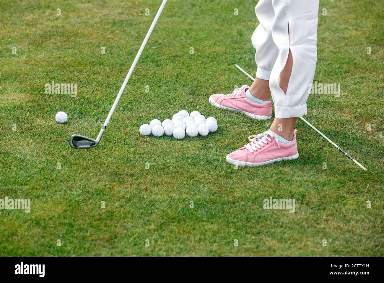 Learning to play Golf. The concept of the game of Golf Stock Photo