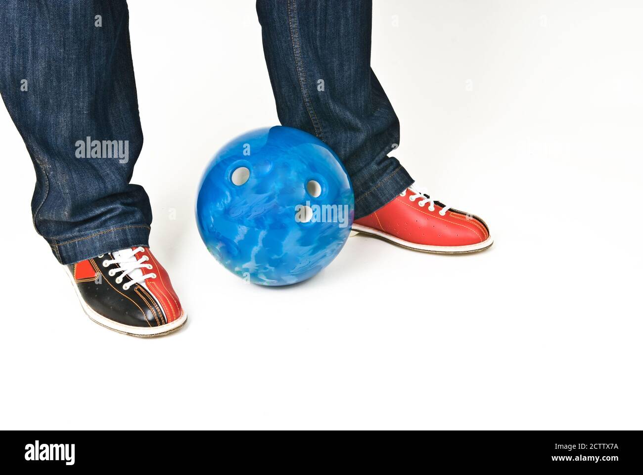 Male feet in bowling shoes and bowling ball on white background Stock Photo