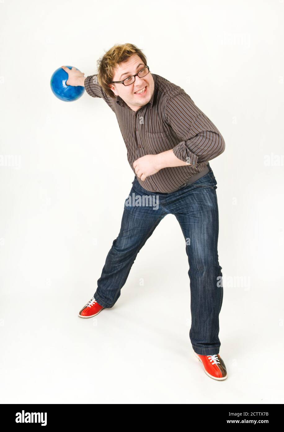 Man playing bowling ball on white background Stock Photo