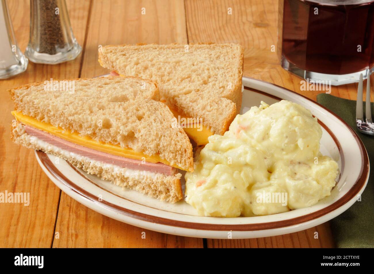 A bologna and cheese sandwich with mustard potato salad Stock Photo Alamy