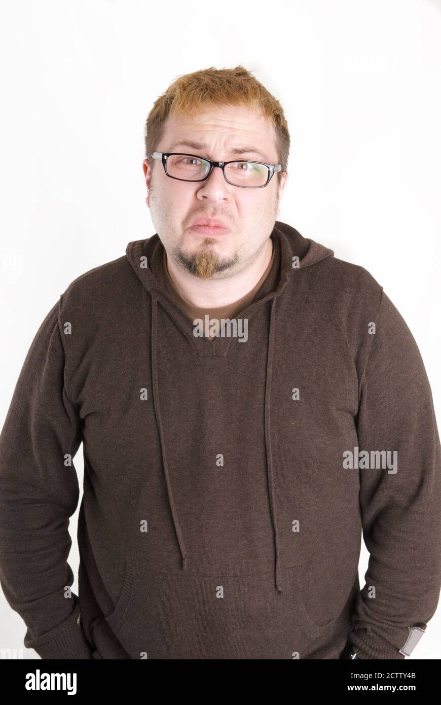 Man with glasses and brown sweatshirt Stock Photo