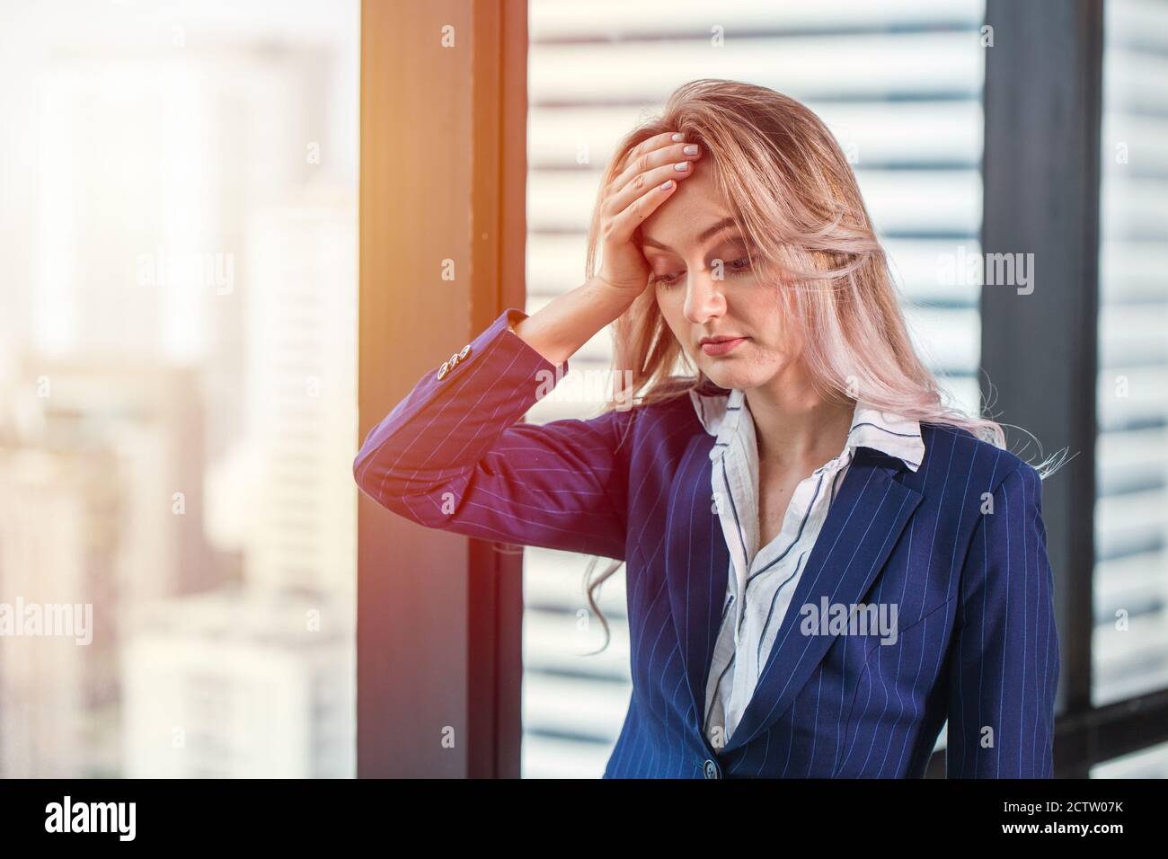 business woman migraine headache from heat, hard work and less rest. Stock Photo