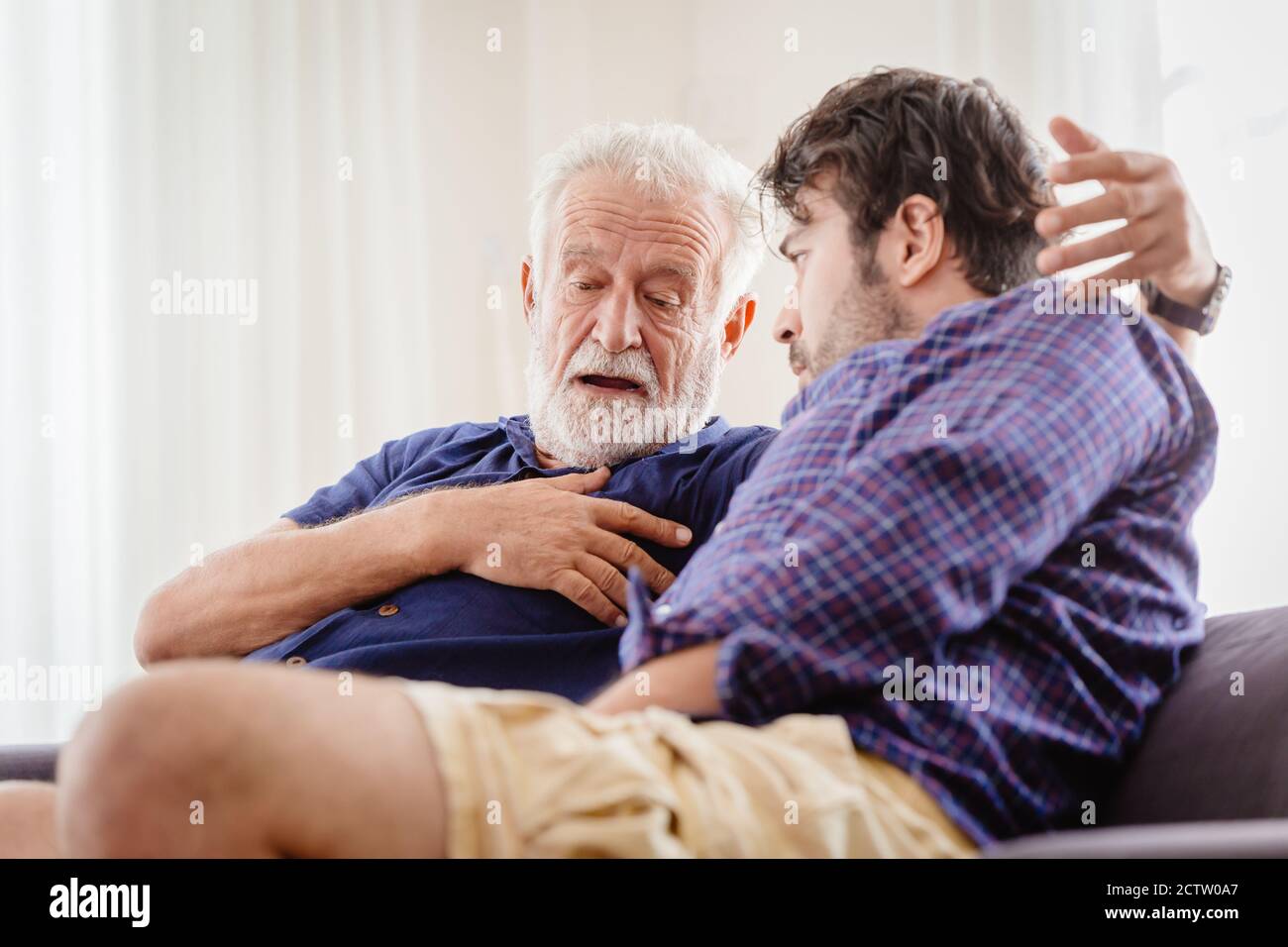 Differences of two generations male elder father with younger man son