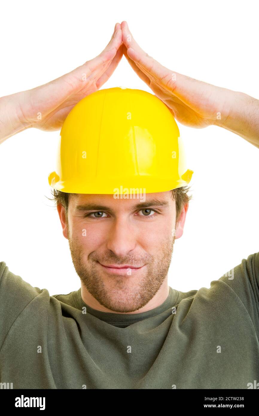 Construction worker with helmet holds hands as a roof over his head Stock Photo Alamy