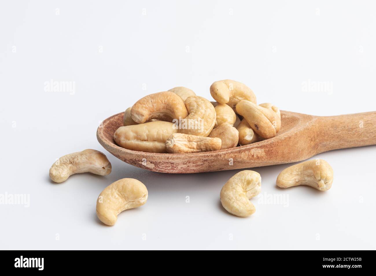 Cashew nuts on a wooden spoon Stock Photo Alamy