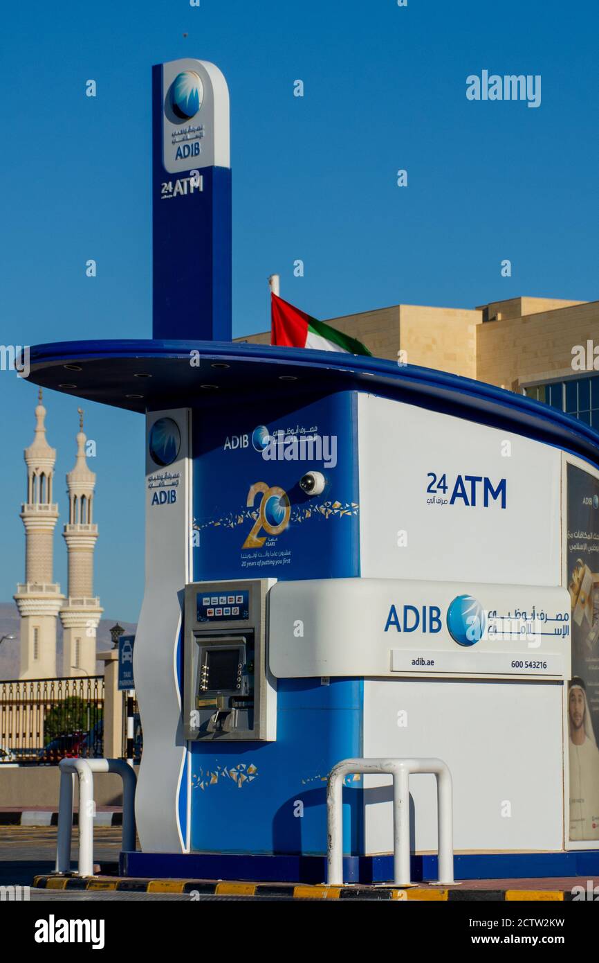 'Ras al Khaimah, Ras al Khaimah/United Arab Emirates - 12/22/2019: 'Abu Dhabi Islamic Bank (ADIB) ATM drive thru/through a blue wide angle shot on a b Stock Photo