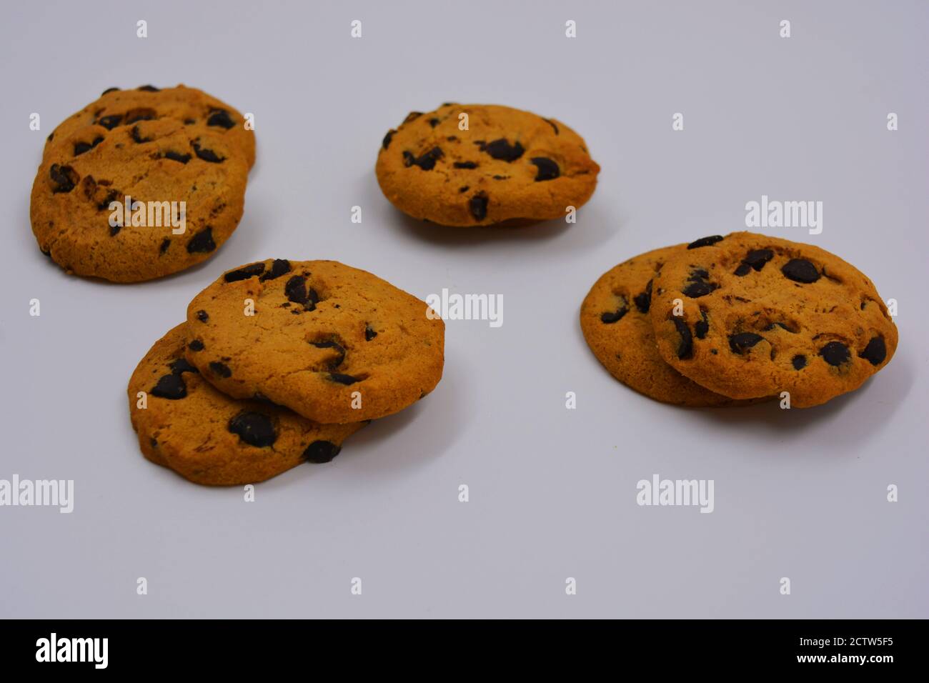 Very sweet shortbread cookie with chocolate pieces located on a white background. Ukrainian popular cookies, very satisfying with the taste of baked. Stock Photo