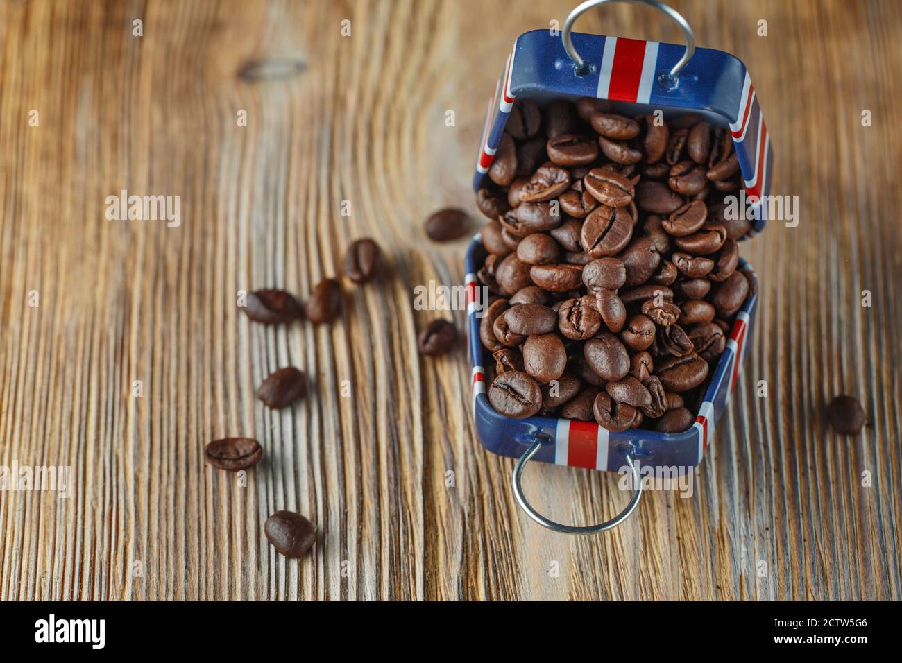 Coffee beans in the small case with britain flag pattern on wooden