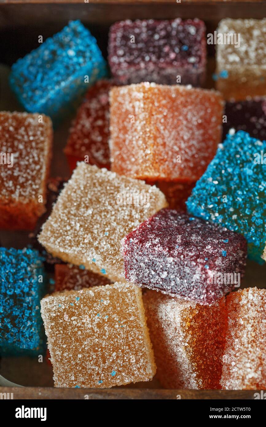 Homemade multicolored marmalade candy in sugar on dark background. Fruit jelly candies. Fruit
