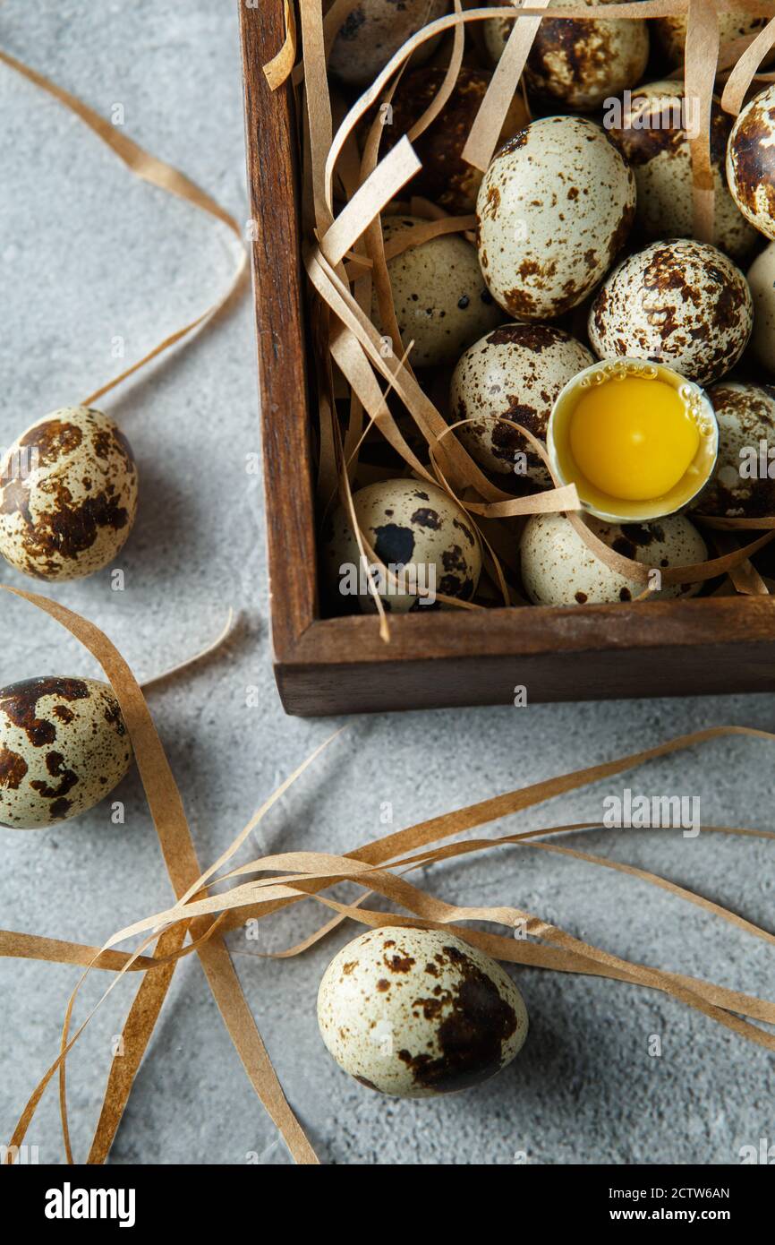 Quail eggs. Flat lay composition with small quail eggs in the wooden