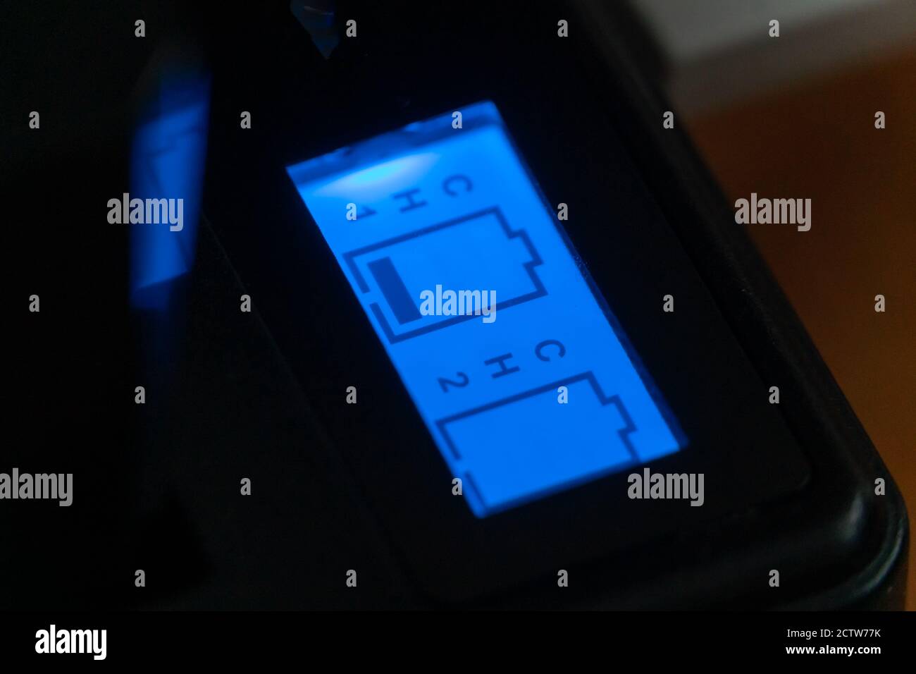 Luminous indicator of the camera battery charger. process of charging the camera's batteries