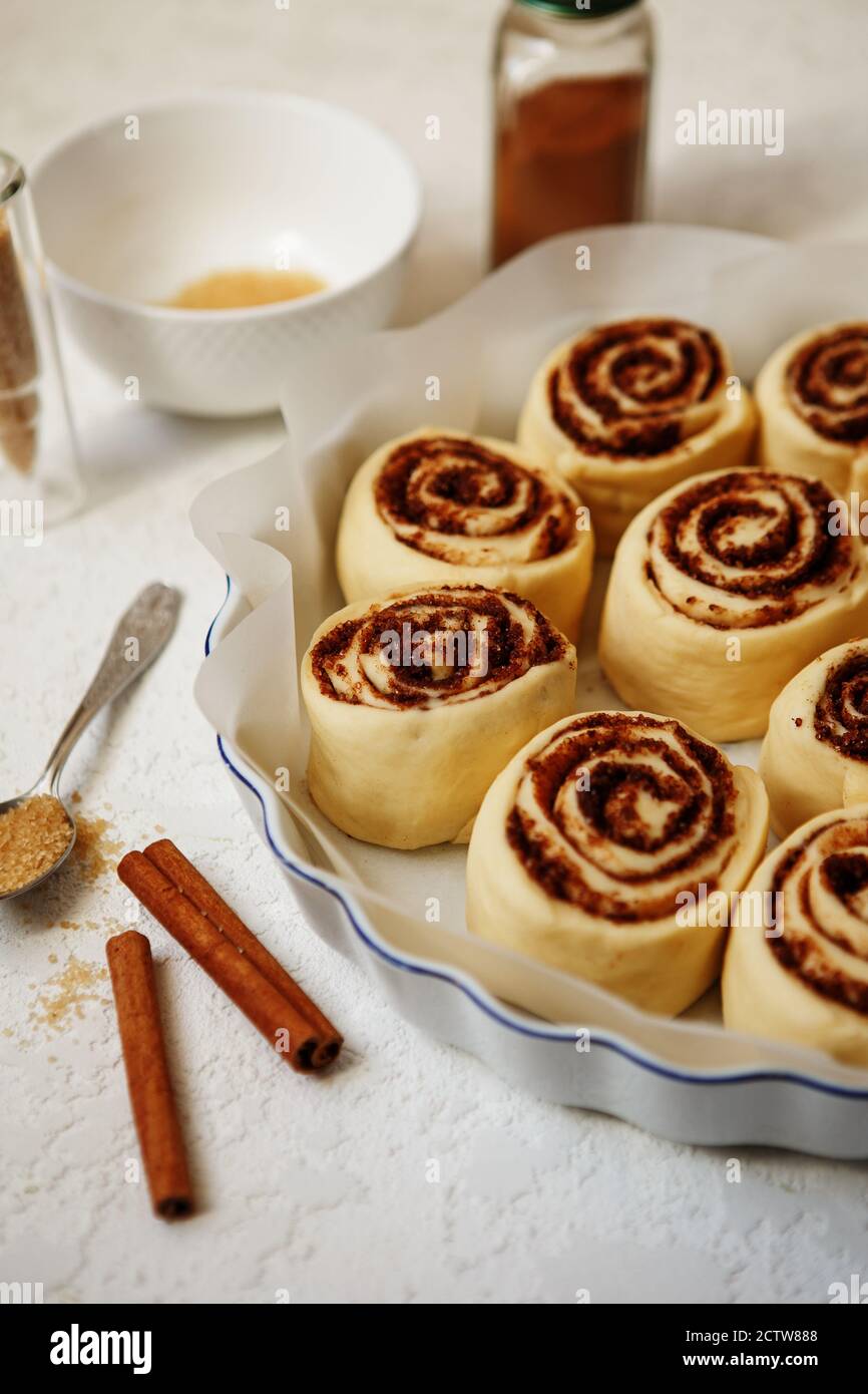 Cinnabon buns. Raw Cinnamon rolls in a baking dish before baking Stock Photo