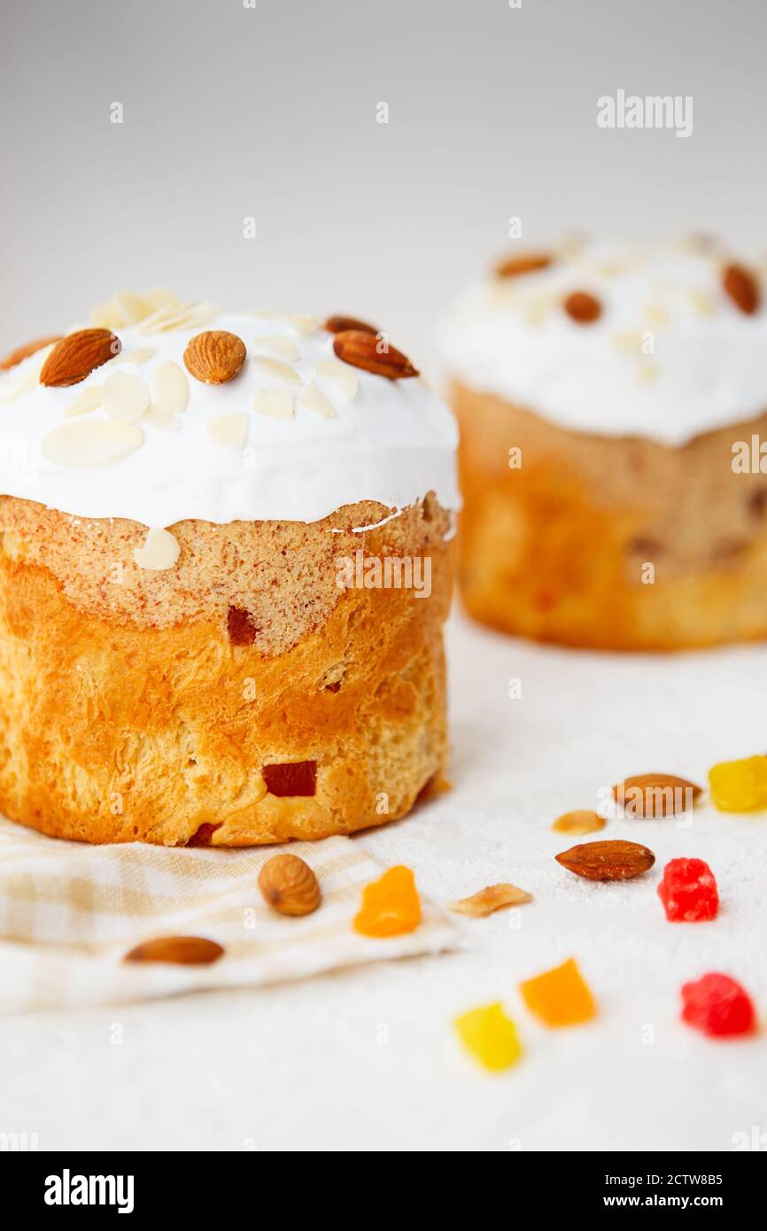 Easter composition. Easter cake decorated with almond petals on a white background Stock Photo