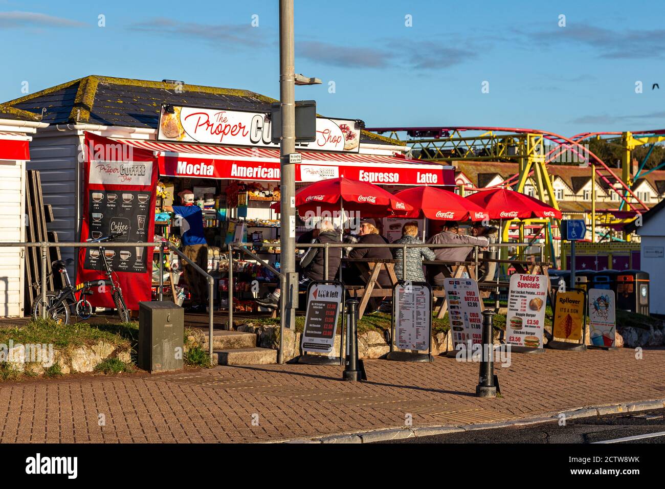 Coffee time in Covid times,UK, Beach Holiday, Bright, Brightly Lit, Devon - England,, Frozen Food, Holding, Horizontal, Ice Cream Cone, Meltin Stock Photo