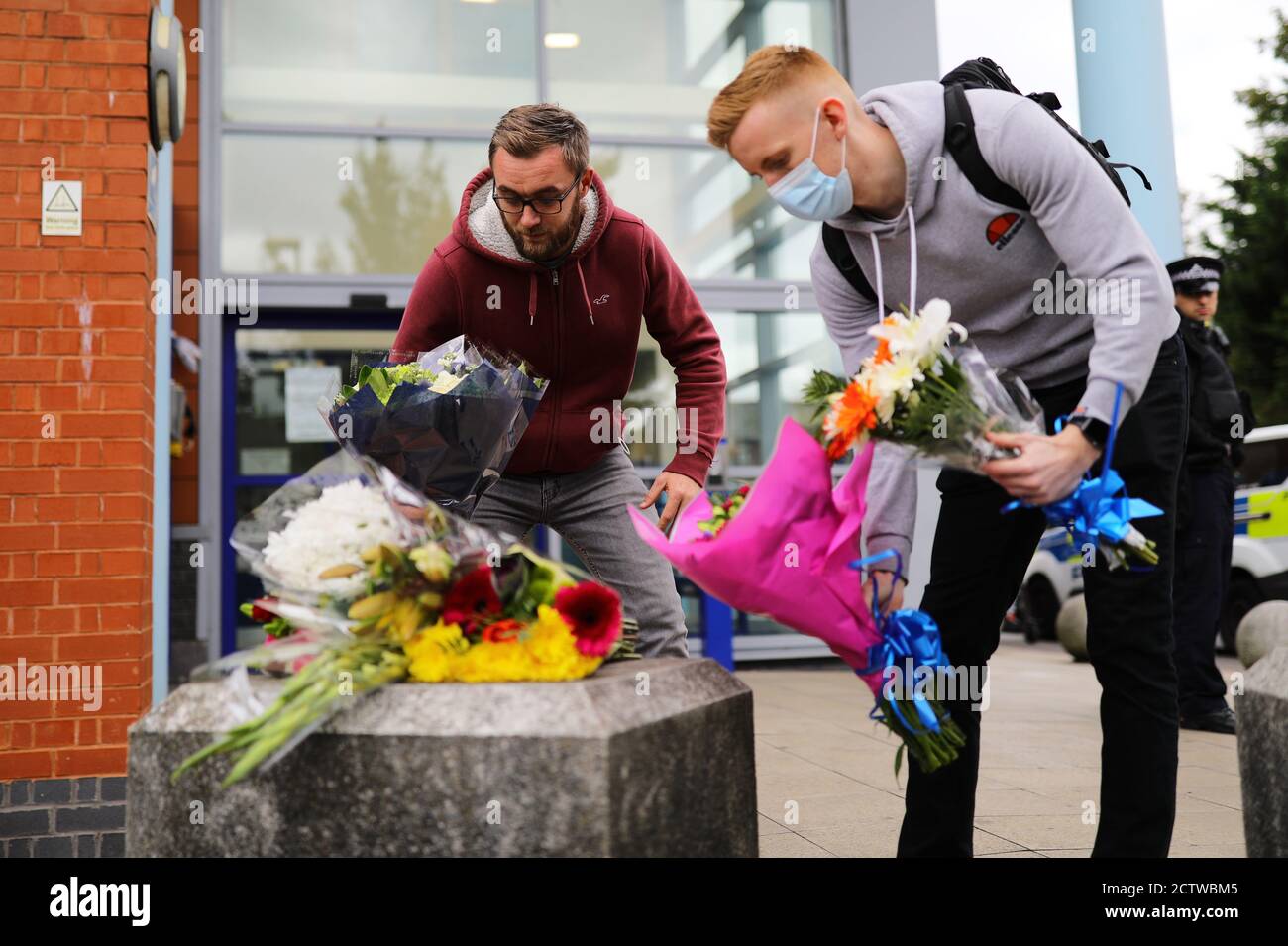 People leave flowers at Croydon Custody Centre in south London where a police officer was shot by a man who was being detained in the early hours of Friday morning. The officer was treated at the scene before being taken to hospital where he subsequently died. Stock Photo