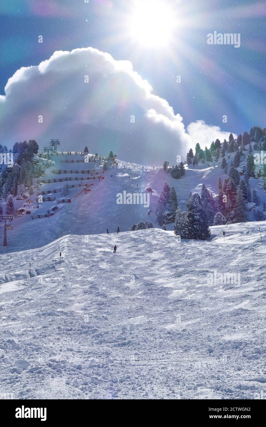 Harakiri ski slope in Zillertal Valley in Tyrol mountains, austrian Alps. Ski resort in Austria. Sunlight flares. Stock Photo