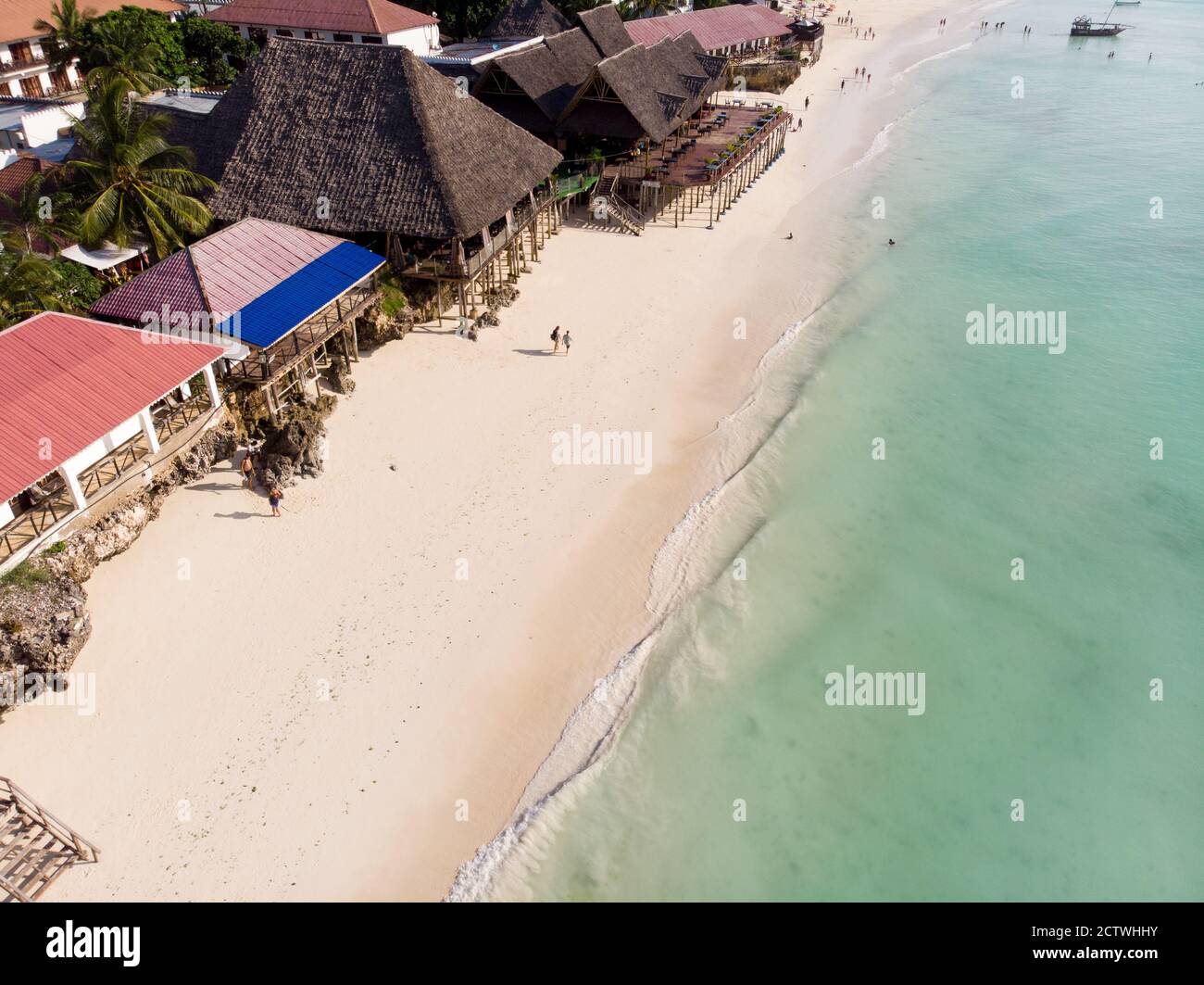 Top Aerial view on the beautiful white sand ocean coast in Nungwi at Zanzibar island, Tanzania Stock Photo